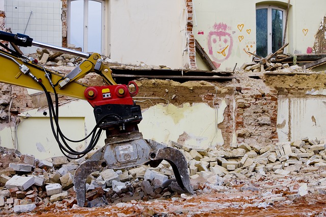 removing asbestos with heavy machinery